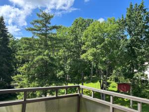 a view from the deck of a home with trees at Kuremaa Lake in Kuremaa