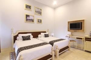 Cama o camas de una habitación en Java Villas Boutique Hotel & Resto