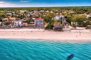 an aerial view of a beach with a resort at Ocean-View Balcony - Uroa 2 bedroom Beachfront apt in Uroa