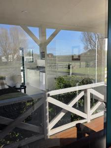 a room with a large window with a fence at Kerry Lane Motel in Hawera +52 photos