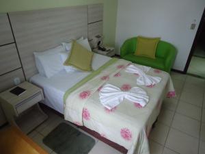 Postel nebo postele na pokoji v ubytování Esplendor Palace Hotel
