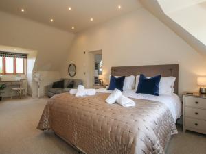a bedroom with a large bed with blue pillows at White House in Montgomery