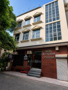 a hotel submission palace building with a sign on it at Hotel Swisston Palace in New Delhi