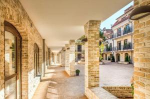 an alley in a building with brick walls at Vilnius Apartments & Suites – Old Town in Vilnius
