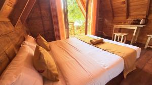 a bedroom with a bed in a room with a window at Nature Bliss Ella in Ella