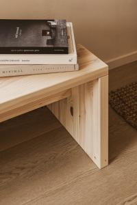 a table with two dvds on top of it at Maison Meraka - Design Guest House of Saint Emilion in Saint-Laurent-des-Combes