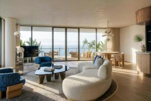 a living room with a view of the ocean at W Barcelona in Barcelona