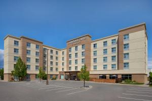 a hotel with a parking lot in front of it at TownePlace Suites by Marriott Thunder Bay in Thunder Bay