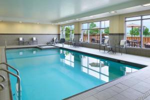 a pool with blue water in a hotel room at TownePlace Suites by Marriott Thunder Bay in Thunder Bay
