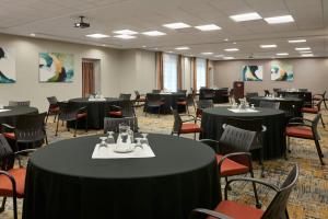 a dining room with tables and chairs and tablesktop at TownePlace Suites by Marriott Thunder Bay in Thunder Bay +27 photos