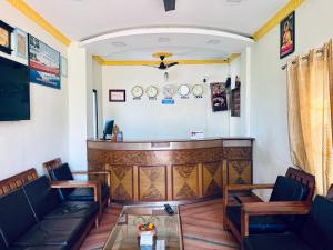 a bar in a restaurant with chairs and a table at Hotel Buddha Palace in Rummindei