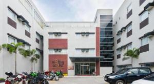 a building with motorcycles parked in front of it at Eighty Eight Hotel in Koronadal