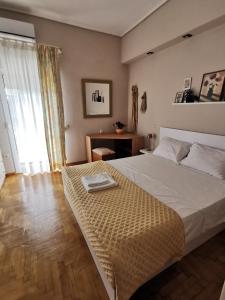 a bedroom with a bed with a tray on it at Spring Harmony Trikala Pigi in Tríkala