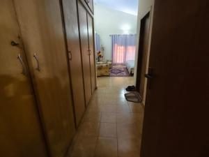 a hallway leading to a room with a hallwayasteryasteryasteryasteryasteryasteryastery at Naqvi House in Murree +1 photo