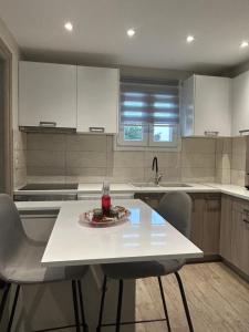 a kitchen with a table with a plate of food on it at Villa Kazani by Karda Suites in Chios