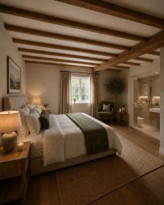 a large bedroom with a large bed and a window at Palms Resort in Hampreston
