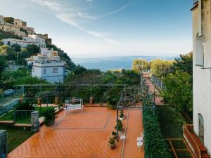 a tennis court with a net on a street at Casa al Belvedere in Vico Equense
