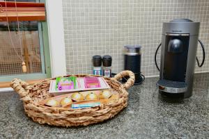 a basket of eggs on a counter next to a coffee machine at Goldsbrough 2 bedrooms split apartment in Sydney +9 photos