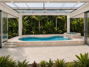 an outdoor pool with a hot tub in a house at Palms Resort in Hampreston