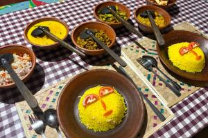a group of bowls of food on a table at Sigiri Anu Homestay in Sigiriya +27 photos
