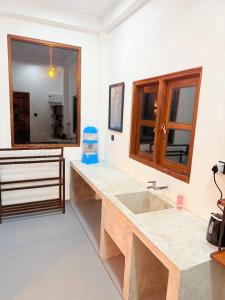 a bathroom with a sink and a mirror at Green Mount View Cottage in Ella +74 photos