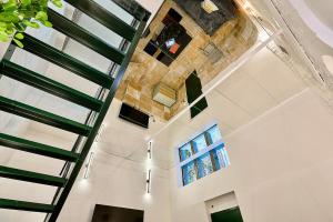 a view from the top of a building with windows at Exceptional double house with Jacuzzi in Lille