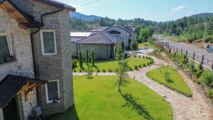 an aerial view of a house with a yard at Ura e Kovacit Resort & Agrotourism in Voskopojë
