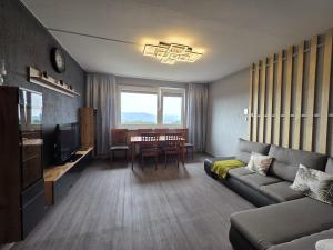 a living room with a couch and a table at U Lose in Liberec