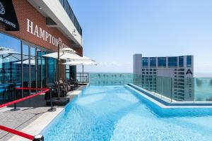 a swimming pool on top of a building at Bona Together In Haeundae Residence in Busan