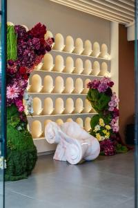 a statue of an elephant standing in front of eggs at Lilybeth Hotel Pratunam in Bangkok