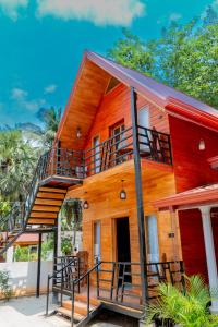 a house with a staircase on the side of it at K Seven Guest Inn in Trincomalee