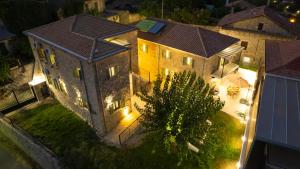an aerial view of a large house at night at Dervisia Stonehouse 3 in Lazaráta