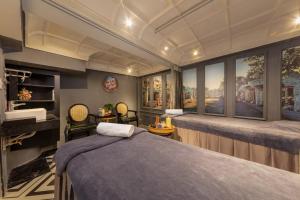 a bedroom with a bed and a large window at Madelise Ensora Hotel & Travel in Hanoi +40 photos