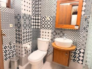a bathroom with a toilet and a sink at Mastic Ev in Chios