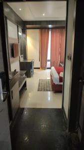 a view of a room with a bed and a bathroom at Hotel bindu in Ghāzīpur +1 photo