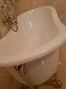 a white bath tub sitting in a bathroom at Antica Dimora Fuori Le Mura B&B in Scanno