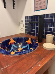 a sink on a wooden counter in a bathroom at Casa Alento in Yzerfontein