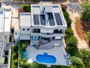 an aerial view of a house with solar panels on it at Studio apartment with pool in Pula +5 photos