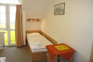 Tempat tidur dalam kamar di Hotel Zámeček