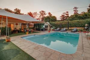 a swimming pool in the backyard of a house at Ridgeworth Boutique Guesthouse in Bellville