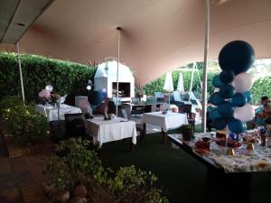 a tent with tables and balloons in a room at Ridgeworth Boutique Guesthouse in Bellville +288 photos