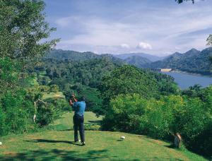 a man standing on top of a hill taking a picture at Kalan Digana in Digana