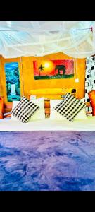 a bedroom with a white bed with pillows at Ella Jungle Rock in Ella