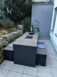 a table with a plant sitting on top of it at Wohnung mit Terrasse in Hirschaid +2 photos
