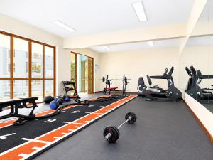 a gym with several treadmills and exercise machines at Lakeview 3BR Apartment Nakuru CBD in Nakuru