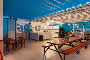 a room with a table and chairs and a kitchen at villa Trung Nghĩa 5 in Da Lat +113 photos