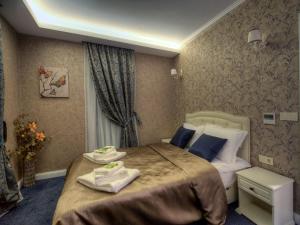 Postel nebo postele na pokoji v ubytování Family Hotel Agoncev + 37 fotografií