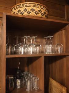a bunch of glass jars sitting on a shelf at Villa Hola Agung in Karangasem