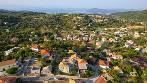 an aerial view of a small town with houses at Dervisia Stonehouse 4 in Lazaráta