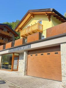 a garage door in front of a house at Hotel Villa Amabile in Villa dʼAllegno